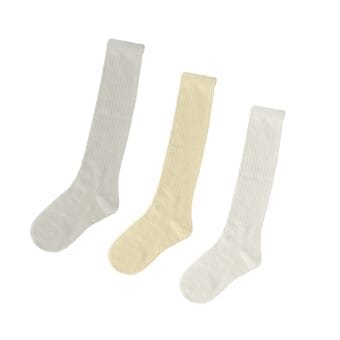 Three knee-high socks laid flat side by side in light grey, cream, and white, each made of ribbed fabric and displayed against a plain background.
